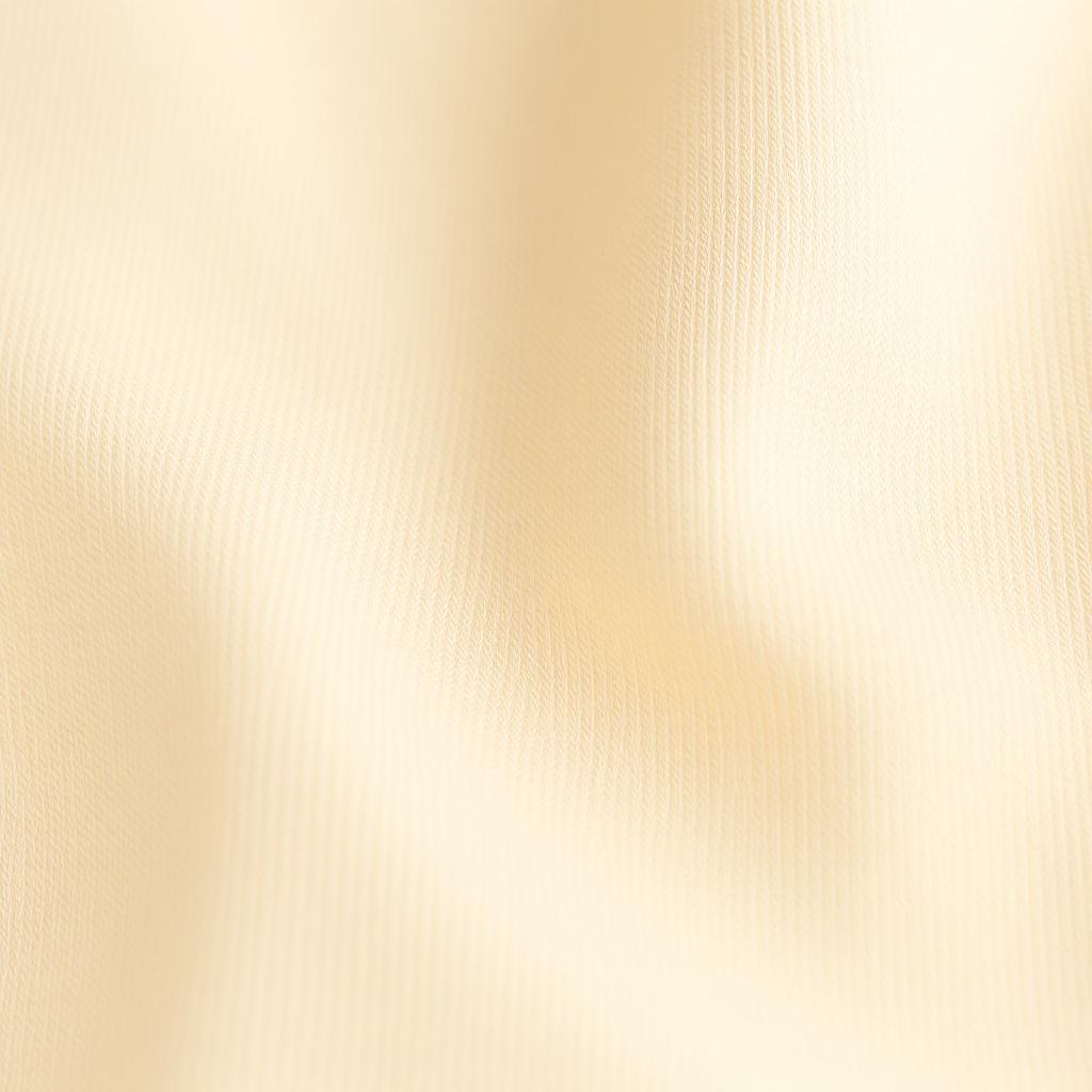 Macro close up of ultra soft buttery activewear fabric texture in a soft beige tone under gentle studio lighting.