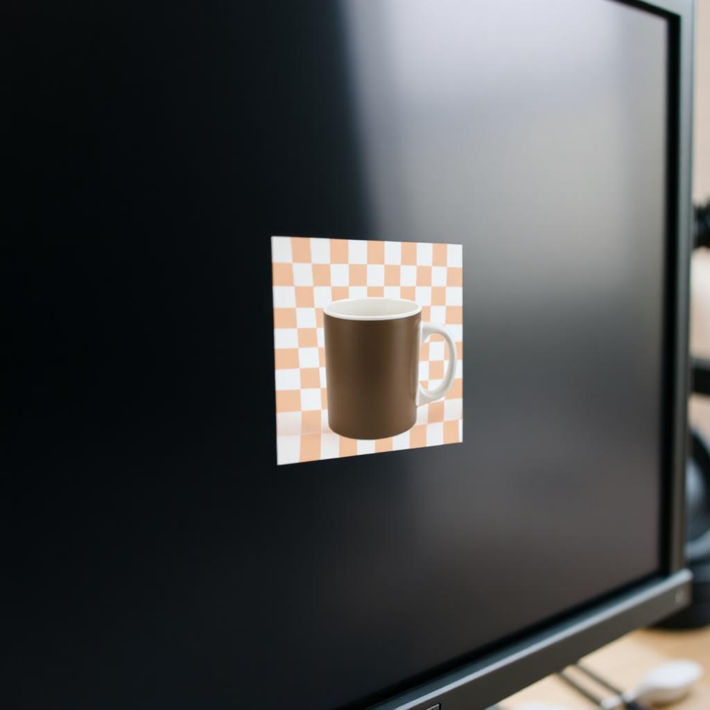 A computer monitor showing a coffee mug isolated on a transparency checkerboard pattern